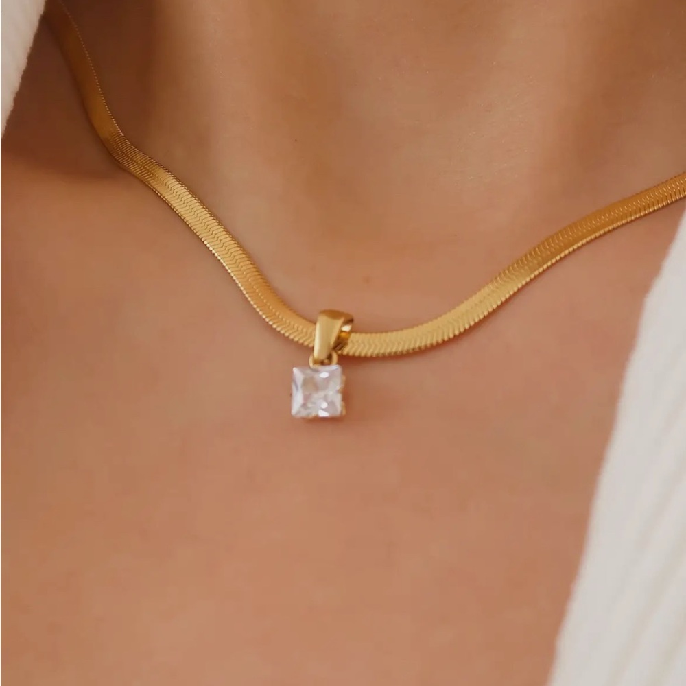 18 karat gold plated herringbone chain with cubic zirconia pendant